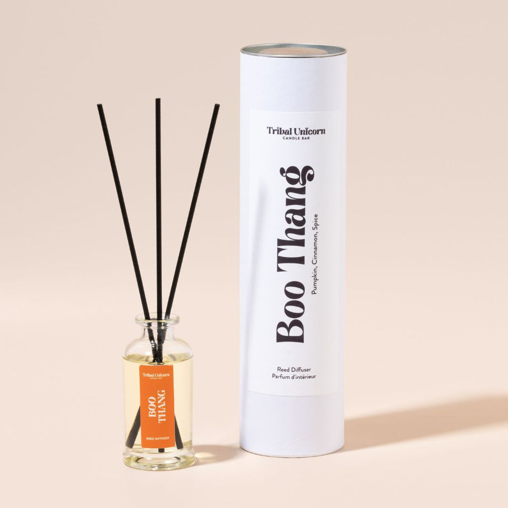 Boo Thang reed diffuser with packaging on a beige background