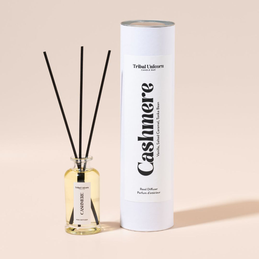 Tribal Unicorn Cashmere diffuser with bottle and packaging on a beige background