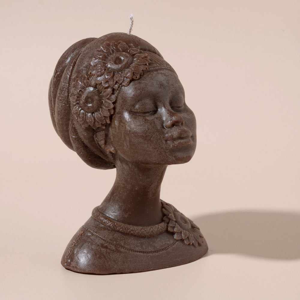 Decorative bust of a woman with a headscarf on a beige background