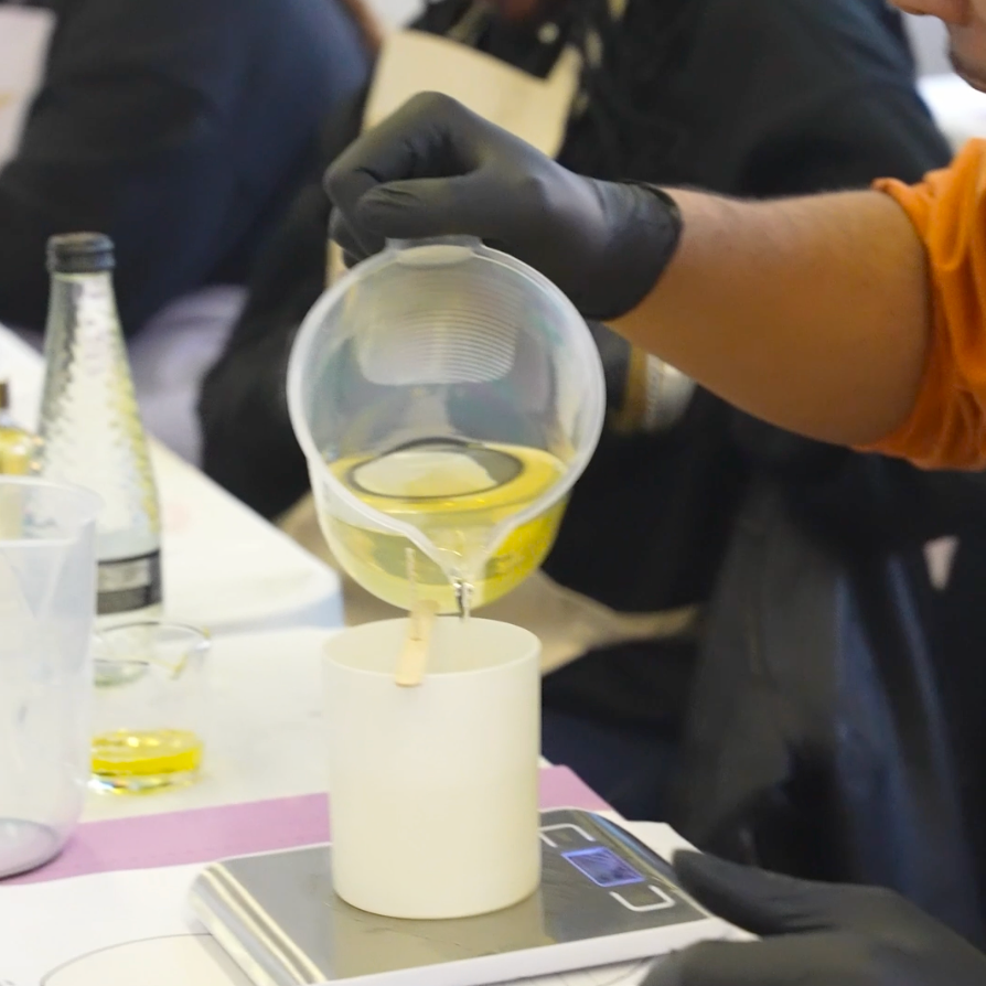 
                  
                    Tribal Unicorn Candle Making Workshop customer making candles
                  
                